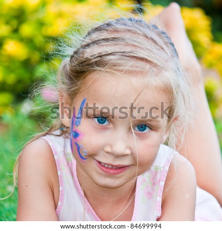 Portrait of a beautiful girl with flower paining on her face