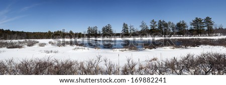 Panoramic winter scene of rural maine in winter