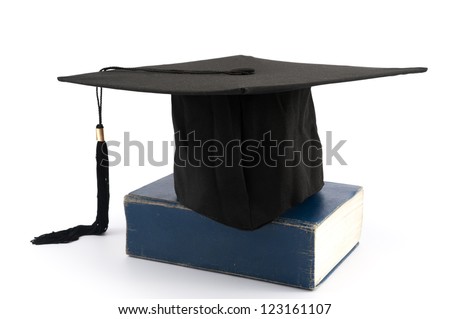 Graduation cap on a thick book