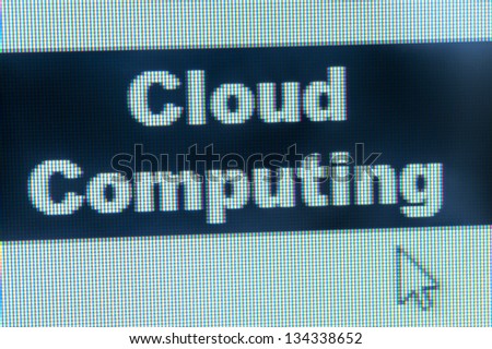 Cloud computing words and cursor on computer monitor