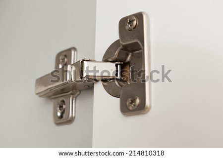 furniture hinge close up view of kitchen cabinet