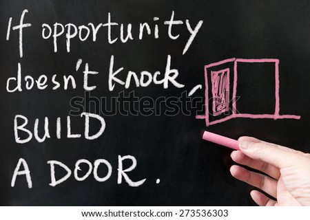If opportunity doesn\'t knock, build a door words written on blackboard using chalk