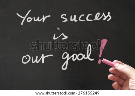 Your success is our goal words written on blackboard using chalk