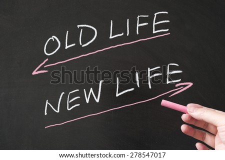 Old life vs new life words written on the blackboard using chalk
