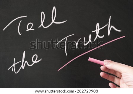 Tell the truth words written on blackboard using chalk