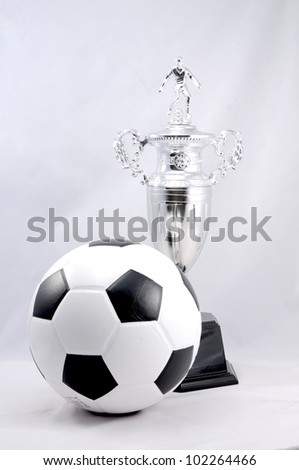 Soccer ball and silver trophy with white background
