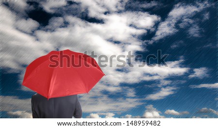 Leader holding red umbrella for show different think with blue sky