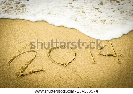 2014 wrote on the beach for welcome new year
