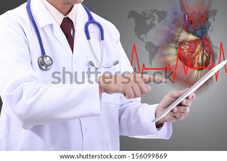 Doctor holding touch pad for check patient heart  with white background