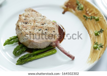 Close up Grilled Pork chop with asparagus