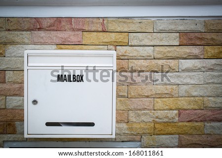 White mail box hang on the rock background