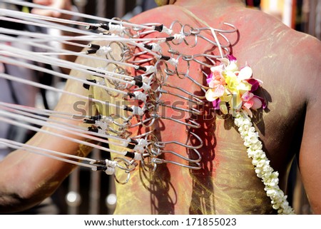 PENANG, Malaysia - JANUARY 17: Hindu devotee carries kavadi himself in Thaipusam festival on January 17, 2014 in Malaysia. Devotees implore to worship God Muruga