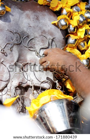 PENANG, Malaysia - JANUARY 17: Hindu devotee carries kavadi himself in Thaipusam festival on January 17, 2014 in Malaysia. Devotees implore to worship God Muruga