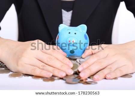 Piggy bank officer put money inside for invest in the future