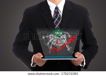 Businessman holding touch pad for presentation to customer
