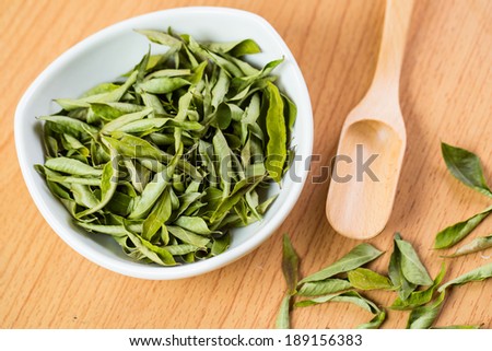 Close up Dried curry leaves with white background