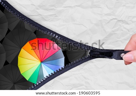 Open zip to show Leader holding multiple color umbrella