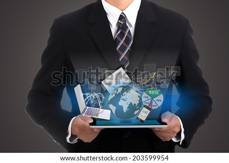 Businessman holding touch pad technology to build your business.