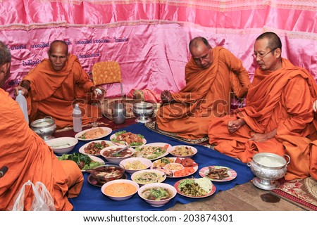 NAKRONPHATHUM THAILAND -JULY 6: Wedding ceremony culture July 6 2014, Monks have breakfast after  finished ritual wedding in Nakronphathum ,Thailand.