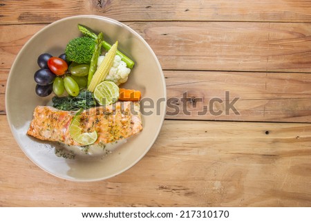 Salmon steak seafood with vegetable on the wood