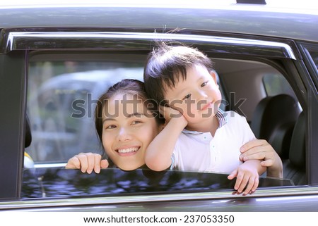 Travel Asian Family preparing with her son in the car