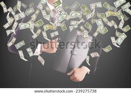 Businessman catching money for investment