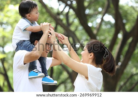 Happy Family enjoy and do activity together in Garden.