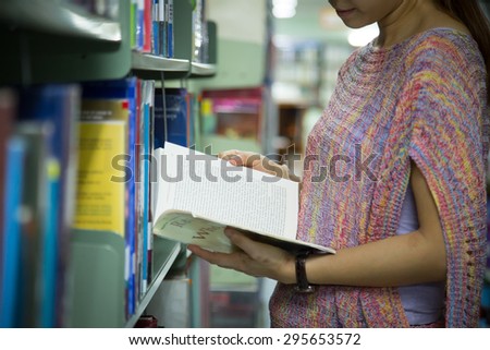 Library ,women student find book for study.