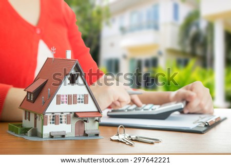 Woman calculate and plan for your good property with real agency property.
