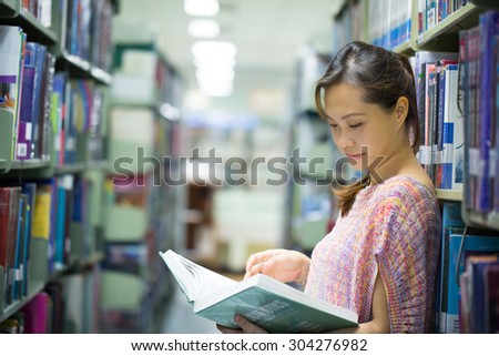 Library ,women student find book for study.