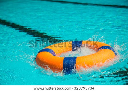 Throw Ring buoy to the pool water.