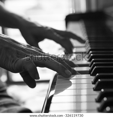 Pianist playing piano for learn melody music.