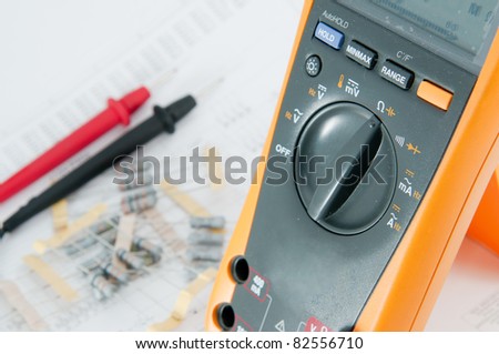 Checking Circuit by Multi-Meter. Electrical Engineer on during checking circuit board unit by Multi-Merer.