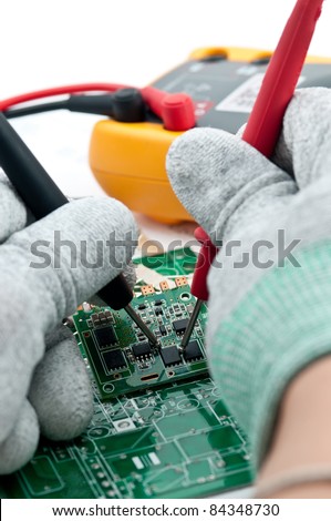 Checking Circuit by Multi-Meter. Electrical Engineer on during checking circuit board unit by Multi-Merer.