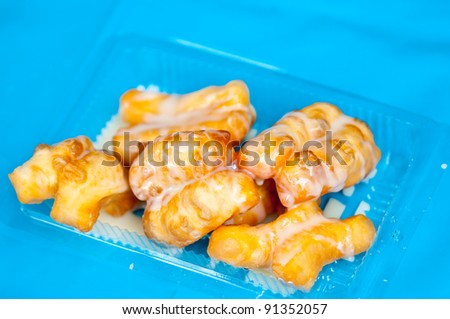 Fritters that chinese call “You Tiao” on clean plastic which have in the morning.