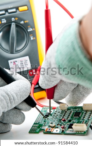 Checking Circuit by Multi-Meter. Electrical Engineer on during checking circuit board unit by Multi-Meter