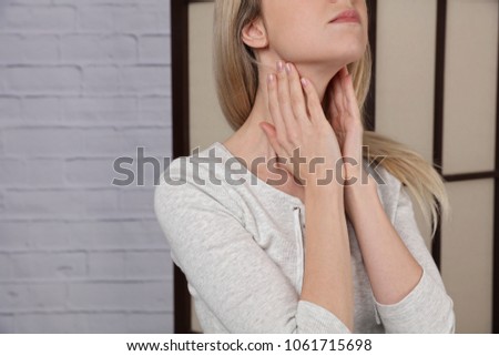 Female neck and shoulders close up. Woman thyroid gland control.