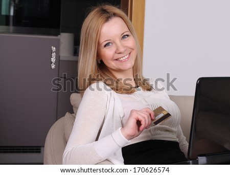 Young beautiful women with laptop and credit card