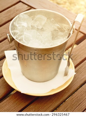 Ice  bucket on wooden table