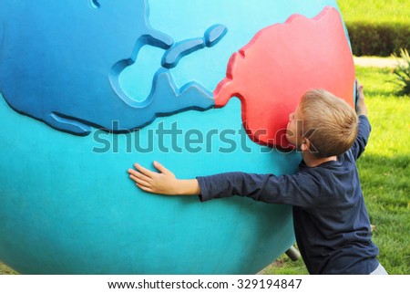 Child Holding World Earth Globe In His Hands. Environmental awareness, Piece, Global Warming, ecology, Global Communications, tolerance, green energy
