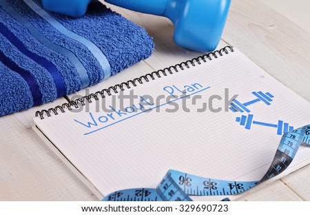 Workout plan,dumbbell and towel . Woman, fitness, sport concept background