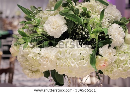 Hydrangea, roses and orchid bouquet. White wedding table flower decoration. Glamorous Event, celebration