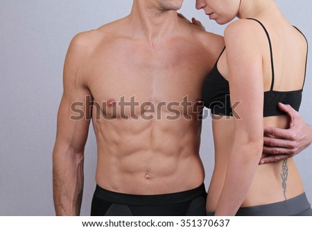 Fit couple,  strong muscular man and shape woman. Love, togetherness, relationship, harmony, sport and  fitness concept.