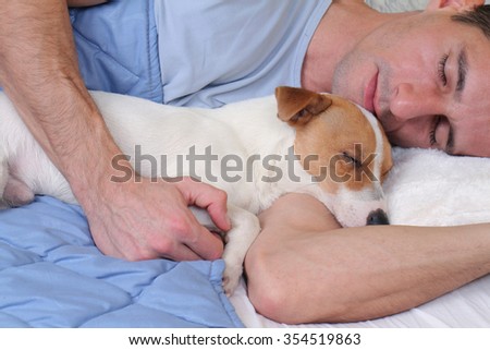 Sleeping dog and owner. Man and dog sleeping together