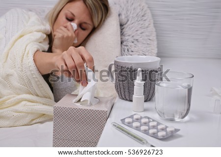 Woman caught cold , flu, running nose. Healthcare and medical concept