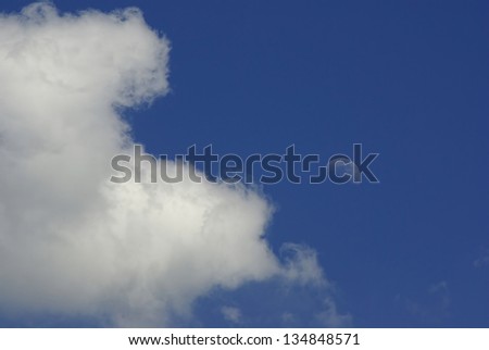 Cloud And Moon - Blue cloudy sky and crescent of the moon.