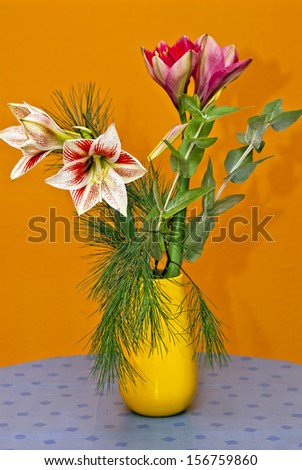 Still Life Of Lily Flowers - Still life of a bunch of cut lily flowers in a yellow vase.