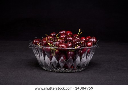 Shot of a freshly washed bowl of cherries in a crystal bowl.