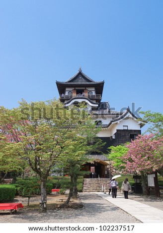 INUYAMA,JAPAN -APRIL 24 : Inuyama Castle and the garden in front of the castle on April 24, 2012 in Inuyama, Aichi, Japan.The castle is national treasure of Japan, built in 1469.