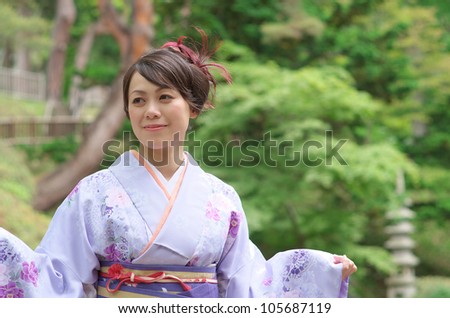 Japanese woman wearing Kimono at Japanese garden
